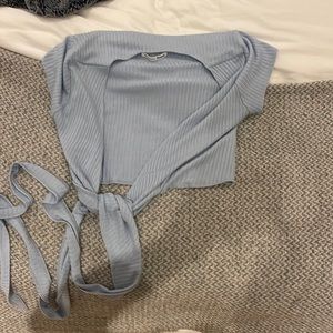 Light blue shirt that ties to the back